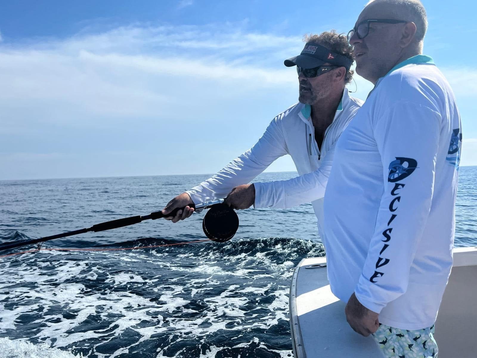 Capt. Brad Philipps coaching an angler aboard Decisive in Guatemala