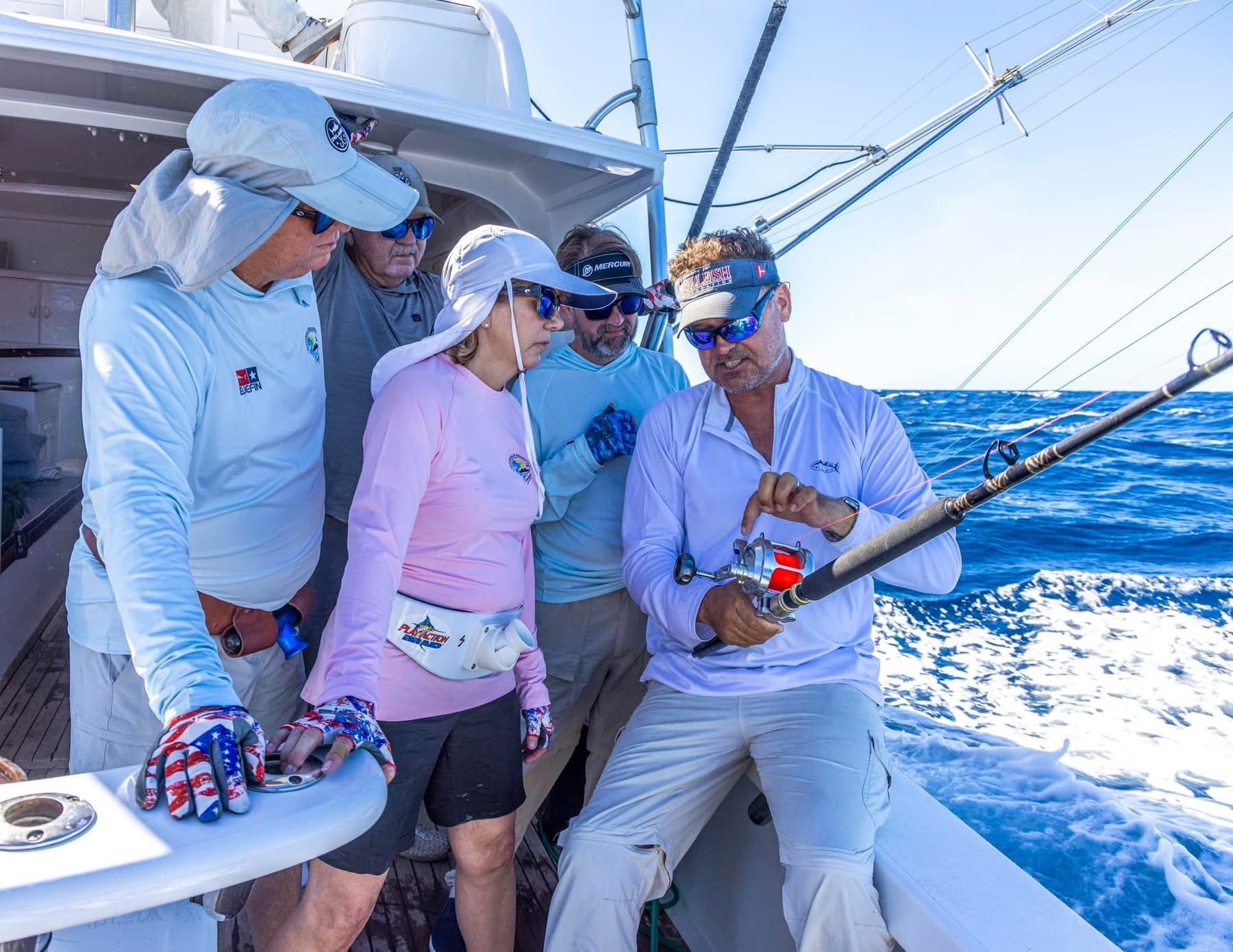 Capt. Brad Philipps coaching an angler aboard Decisive in Guatemala